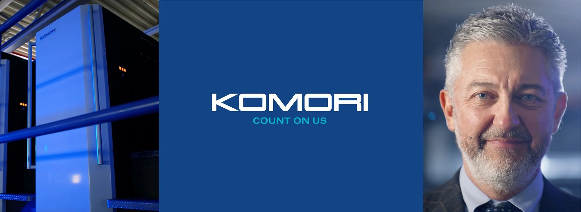 Komori-campagnebeeld met drukpers en medewerkers.